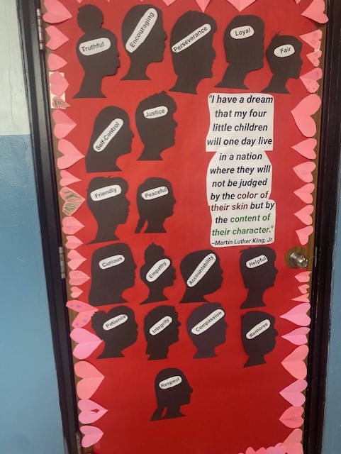 Picture of a door decorated with silhouettes of Lincoln fourth-graders and words reflecting King's dream.